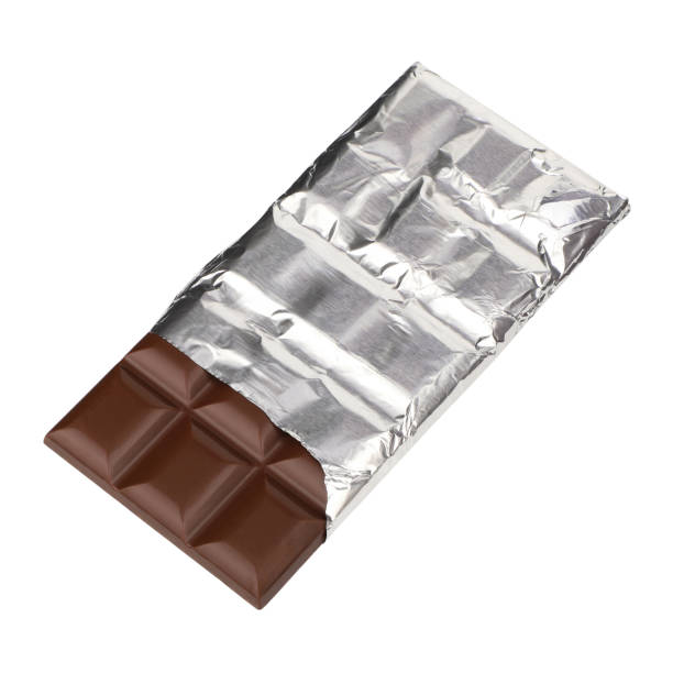 istock Milky chocolate isolated on a white background. dark chocolate wrapped in an aluminum package. clipping path. 1955349976