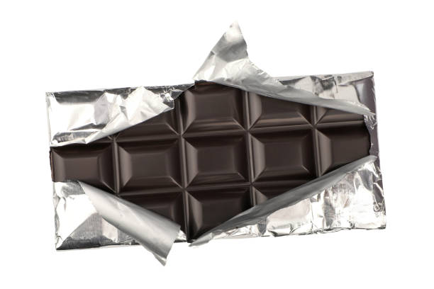 istock dark chocolate isolated on a white background. dark chocolate wrapped in an aluminum package. clipping path. 1955351025