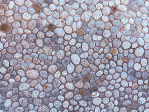 Ground stone grey background of many small stones