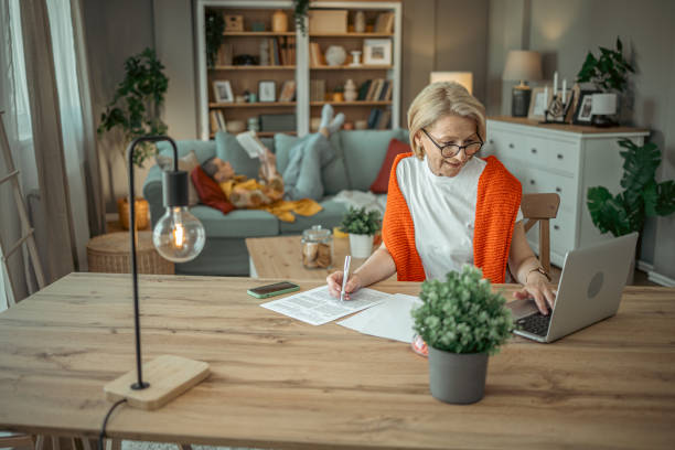 istock Senior woman using laptop 1955389304