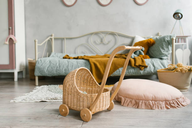 istock A toy wicker stroller in the children's room 1955422619