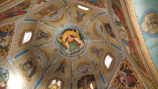 Painting of the dome in the middle of the church. Interior of the temple