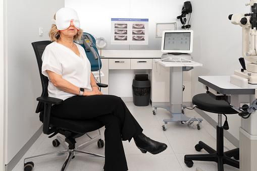 Female ophthalmologist in her own modern clinic