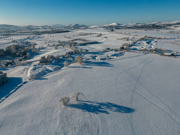 istock Aerial view of a snow covered winter landscape 1955463402