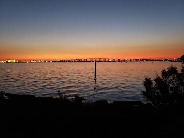 istock Bridge on the Bay at Night 1955470939