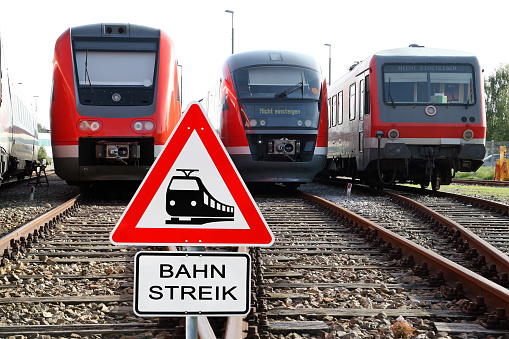 Strike at the German Federal Railways. Rail strike sign, rails and trains