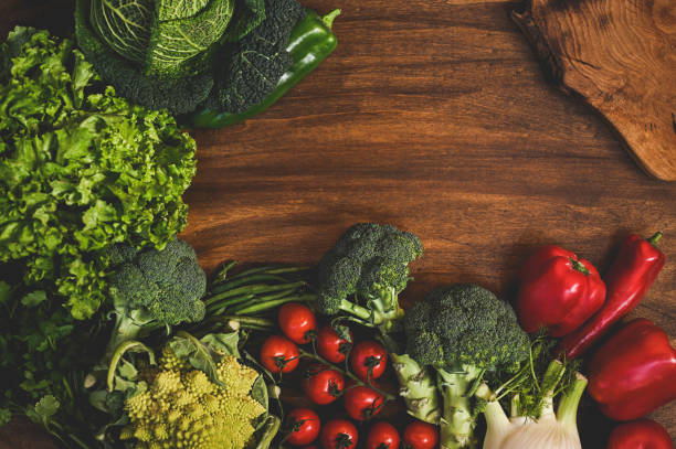 istock Autumn vegetables on a wooden table with copy space. 1955482914