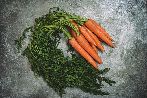 Carrots on a gray background.