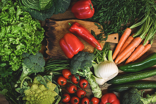 Healthy food. Fresh and juicy vegetables on a wooden table