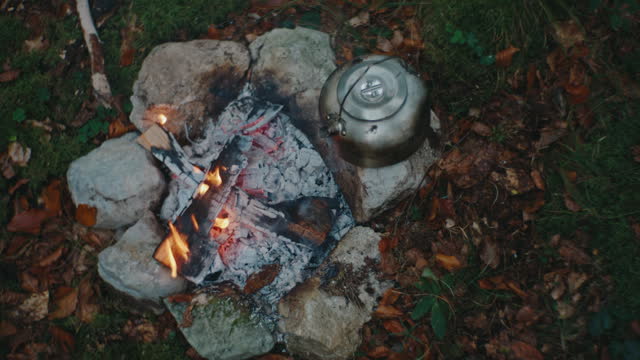 SLO MO Fireside Stillness: Tranquil Campfire Scene from Above