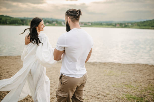 istock Happy couple by the lake 1955509312