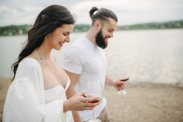 istock Couple walking by the lake 1955564347