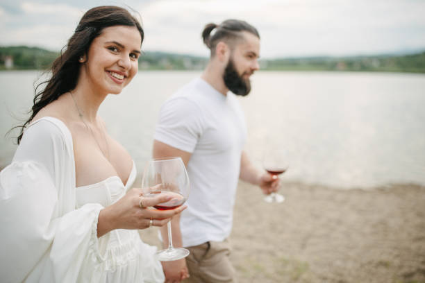istock Couple walking by the lake 1955564882