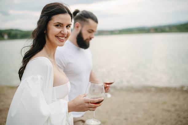 istock Couple walking by the lake 1955565423