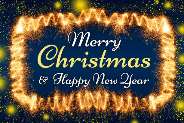 Merry Christmas and Happy New Year lettering in a frame made of sparkler trace with defocused glowing lights.