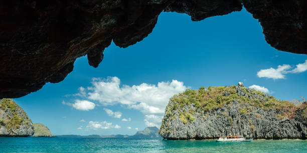 istock Beautiful Asian beach with clear azure water and rocks 1955607621