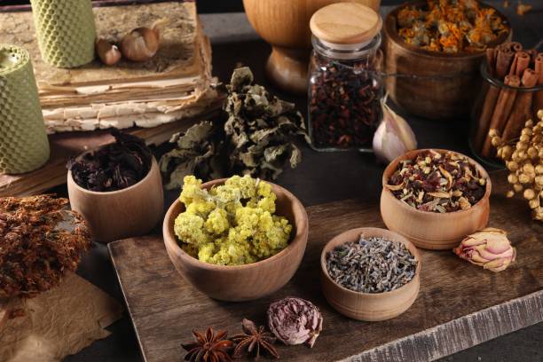 istock Many different dry herbs, flowers and spices on dark grey table 1955626207