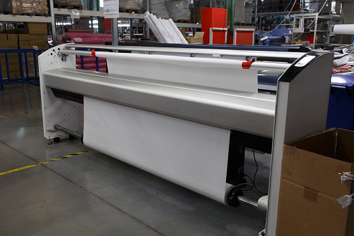 Wide-format inkjet printer plotter. Large industrial monochrome plotter for printing patterns and layouts from CAD in the preparation of production in the garment industry, the production of products made of soft materials