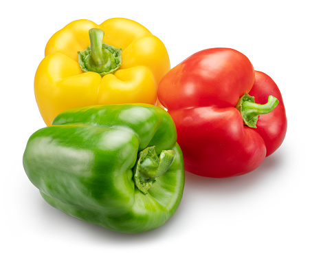 Green, yellow and red bell peppers isolated on white background. File contains clipping path.
