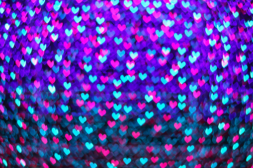 multicolored neon blur heart shape light from camera lens for pattern and background.