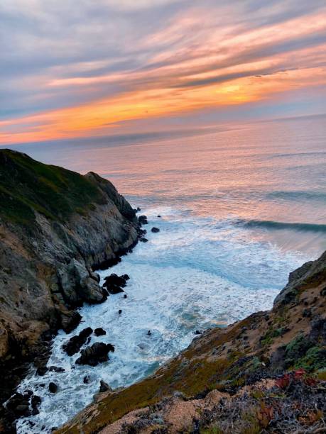istock Awe-inspiring sunset casts a warm glow over the tranquil ocean view 1955650291