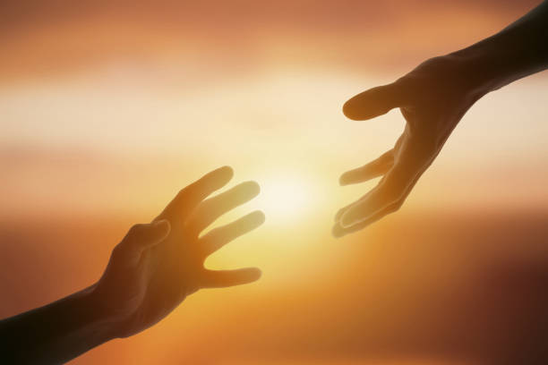 istock Giving a helping hand on sunset 1955663668