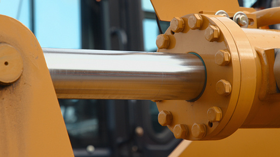 Close-up of part of the hydraulic lifting mechanism of a construction wheel loader