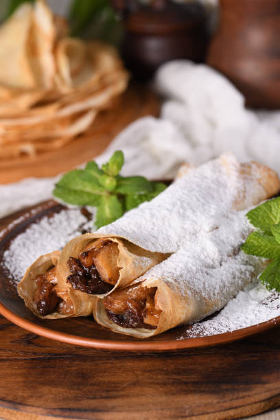 istock Homemade thin crepe (pancakes) with apple filling 1955684302