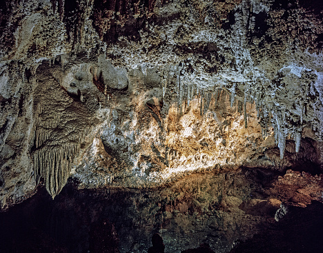 Caverns located in the Chihuahuan Desert of New Mexico revealing stunning treasures. They contain stalagmites and stalactites formed from dipping waters. They can form quickly or whereas limestone may take thousands of years.