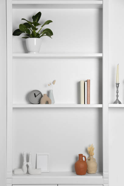 istock Shelving unit with houseplant and different decor indoors. Interior design 1955694367