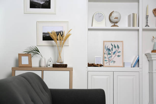 istock Living room interior with shelving unit, sofa and different decor 1955702150