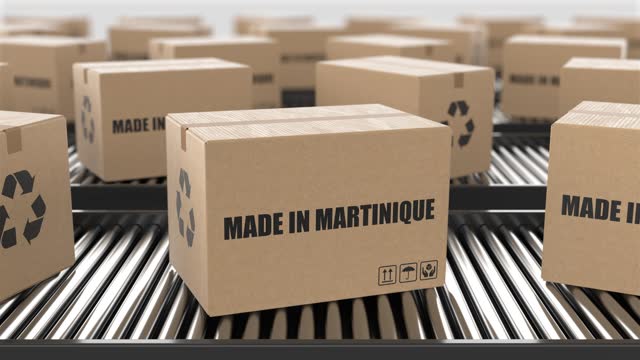Cardboard boxes with Made in Martinique text on roller conveyor. Factory production line warehouse. Manufacture export or delivery concept. 3D render animation. Seamless loop