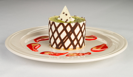 A unique dessert to treat yourself.  This pistachio white chocolate mousse petite dessert will be a treat to your taste buds.