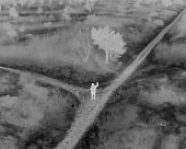 Thermal image of a person waving in the dark