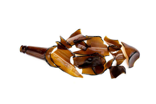 istock Broken brown bottle, glass shards on white background 1955781464
