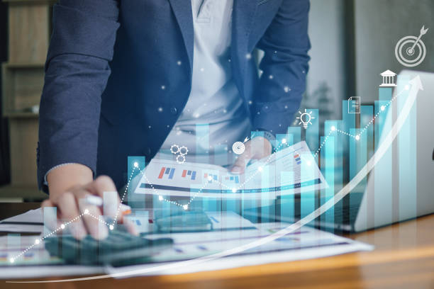 istock Business people using laptop with digital visual reality of graphics, graph investments for analysis market, growing graph and demand. 1955798085