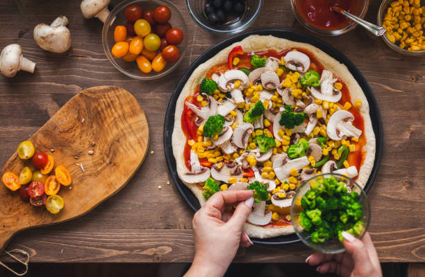 istock Making a Vegetarian Pizza at Home 1955806973