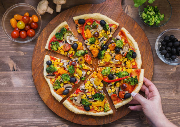 istock Vegetarian Pizza with Broccoli, Cherry Tomato, Pepper and Mushrooms 1955806988