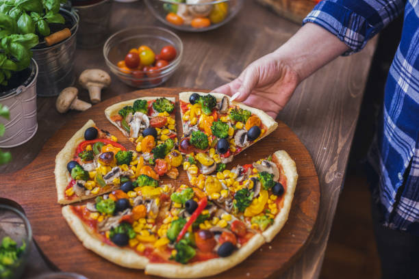 istock Vegetarian Pizza with Broccoli, Cherry Tomato, Pepper and Mushrooms 1955806991