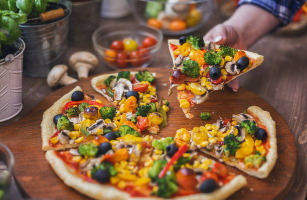 istock Vegetarian Pizza with Broccoli, Cherry Tomato, Pepper and Mushrooms 1955806996