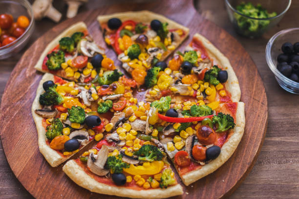 istock Vegetarian Pizza with Broccoli, Cherry Tomato, Pepper and Mushrooms 1955807511