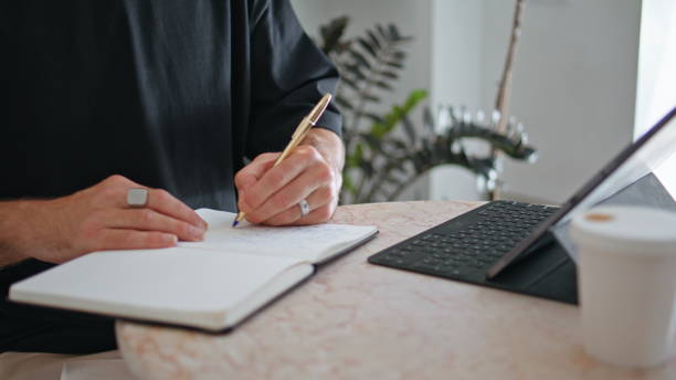 istock Senior hands writing pen indoors closeup. Stylish mature businessman make notes 1955812193