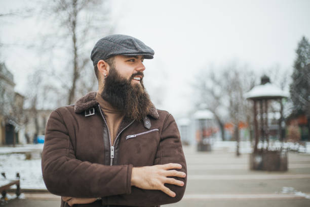 istock handsome hipster guy in the city 1955824412