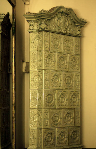 Close-up of a blue and white decorative tile pattern featuring geometric floral motifs and symmetrical circular shapes.