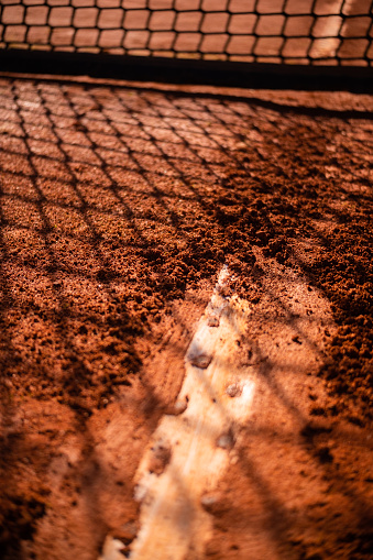 Detail shot of clay court surface, Shadows on ground