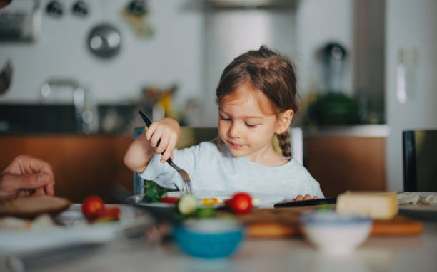 istock A Happy Beautiful Cute Girl Having Breakfast At Home 1955925735
