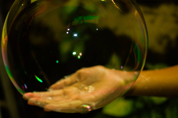istock soap balloon in the hands of a child 1955960849