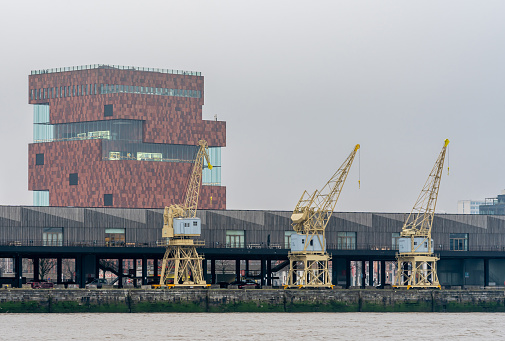 Antwerp, Belgium, 14.01.2024, View of the iconic MAS Museum aan de Stroom with river Scheldt in the foreground