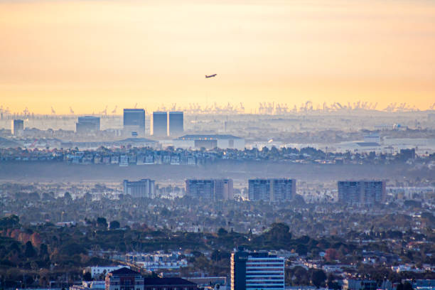 istock Airplane taking off over the city at dawn 1956005698