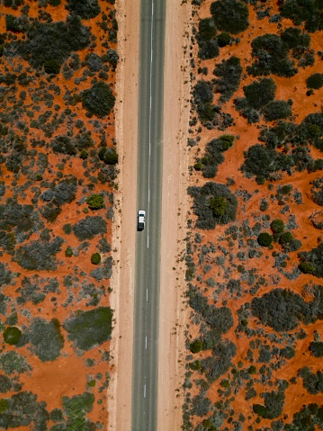 A single road through the Australian bush.